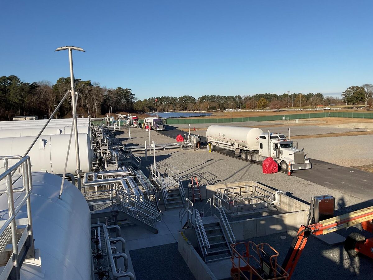 Greenville Utilities GreenER LNG site — sunny day view of the patented tank installation with truck and full piping infrastructure